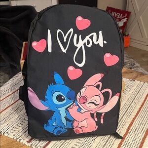 Black Backpack with Blue and Pink Cartoon Design